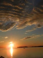 Clouds And Sun On Lake