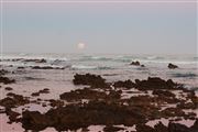 Sunset And Moon On Beach Horizon