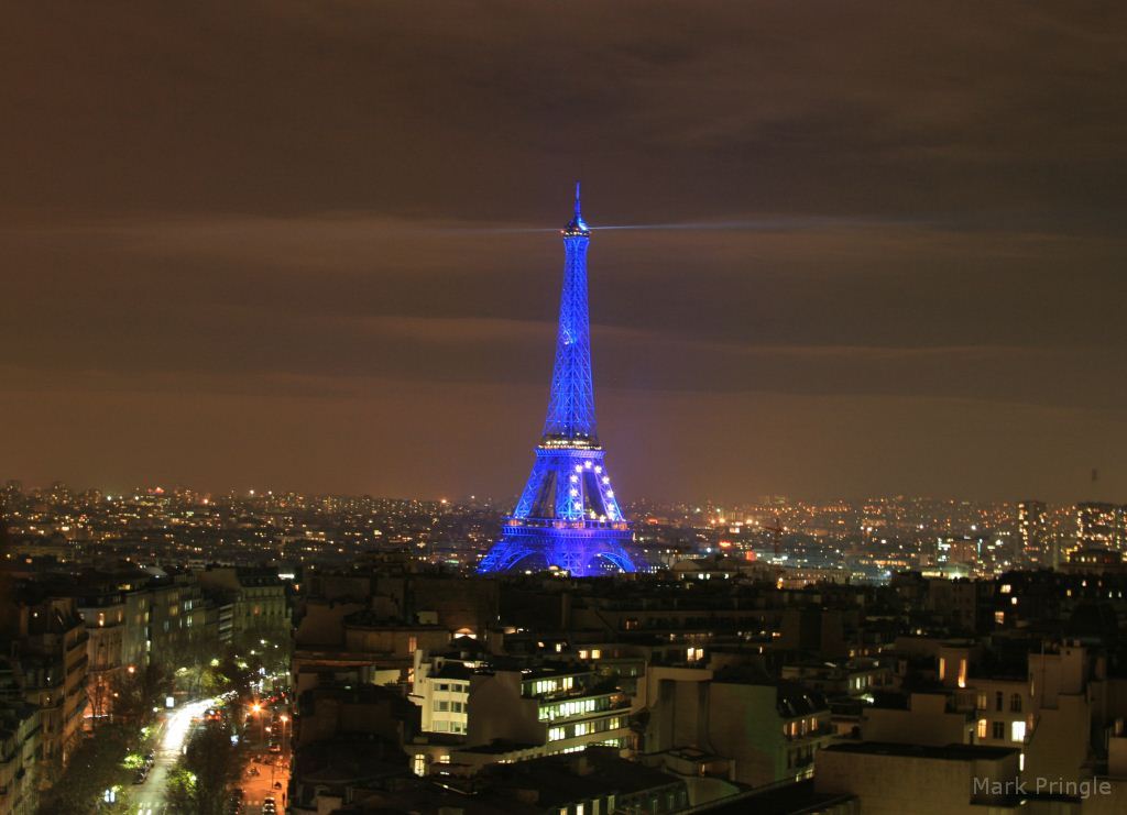 View of the Eiffel Tower from the Arc de Triomphe at Night