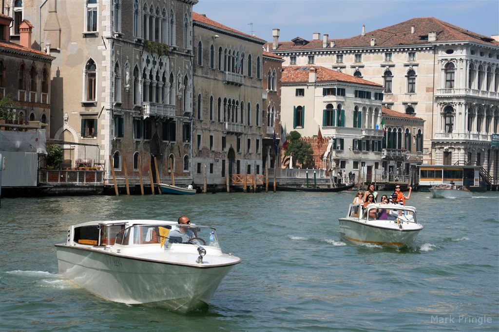 Two Boats Speeding Along The Grand Canal