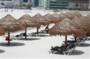Grass Huts On The Cancun Beach