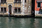 Venice Gondola Coming Out Of A Minor Canal